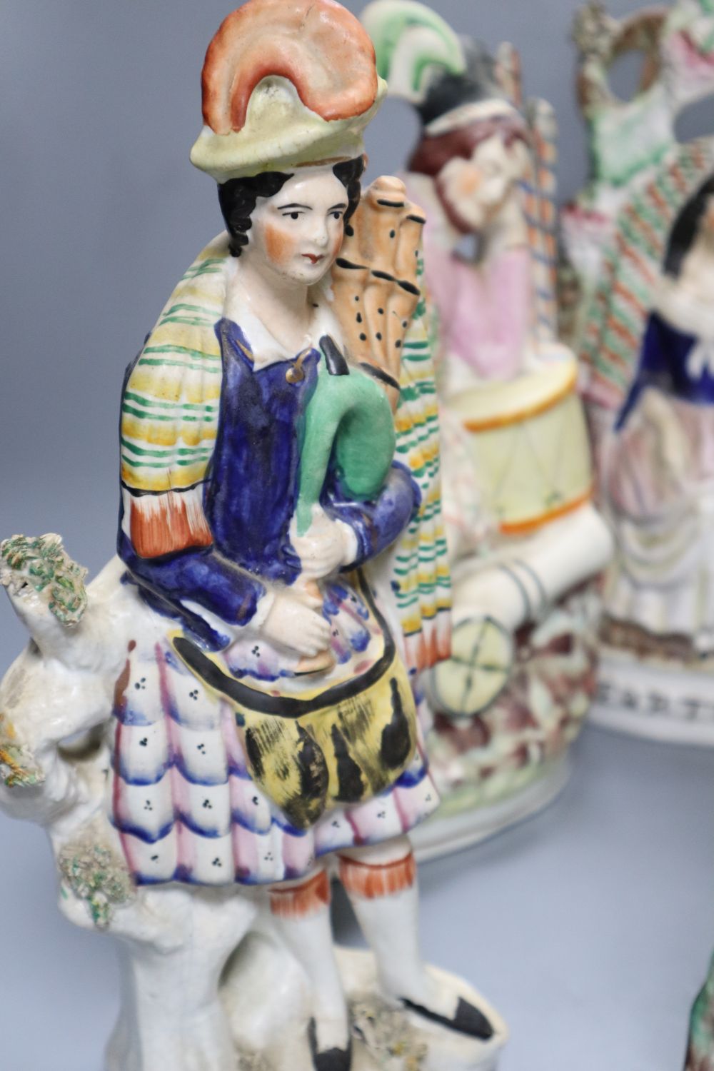 A collection of Staffordshire figures, including a flatback entitled Fortune Teller, height 32cm,